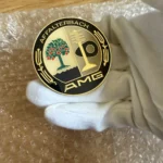AMG PRE MERGER GOLD PLATED HOOD BADGE EMBLEM